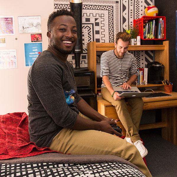 Two male students in their dorm room